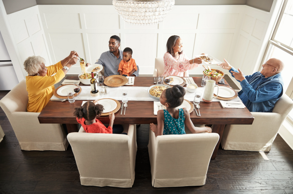 Happy family enjoin breakfast | Thornton Flooring